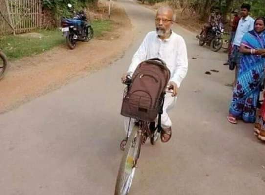 A sadhu on his cycle